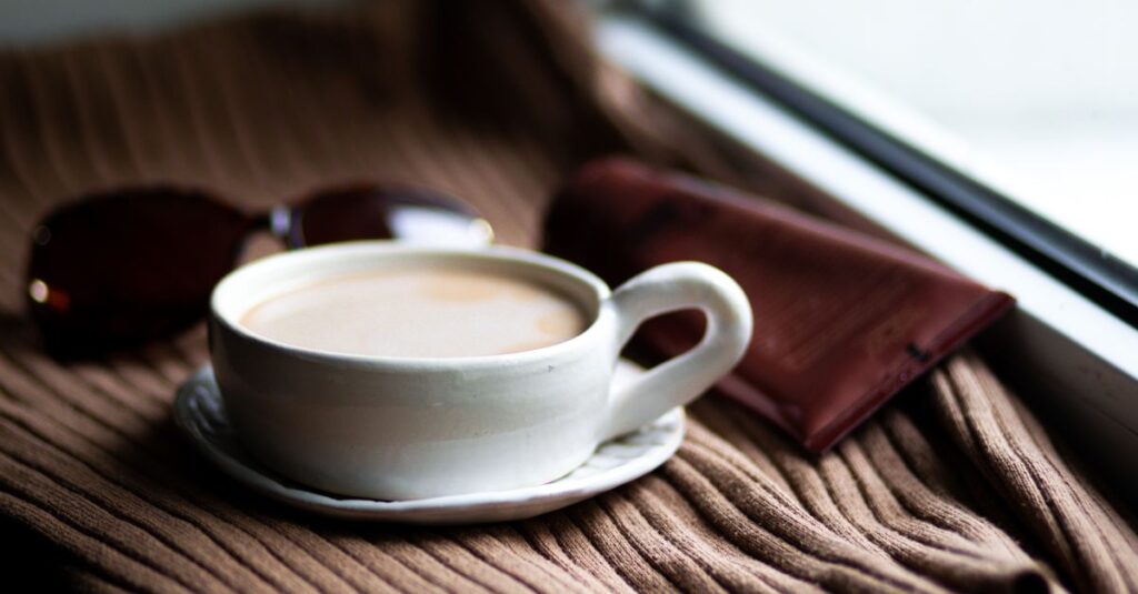 warm drink notebook window light quiet safe place