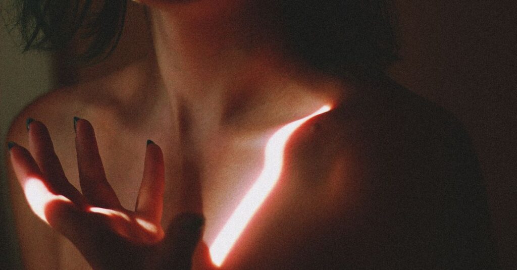 gentle hands near chest warm dim light