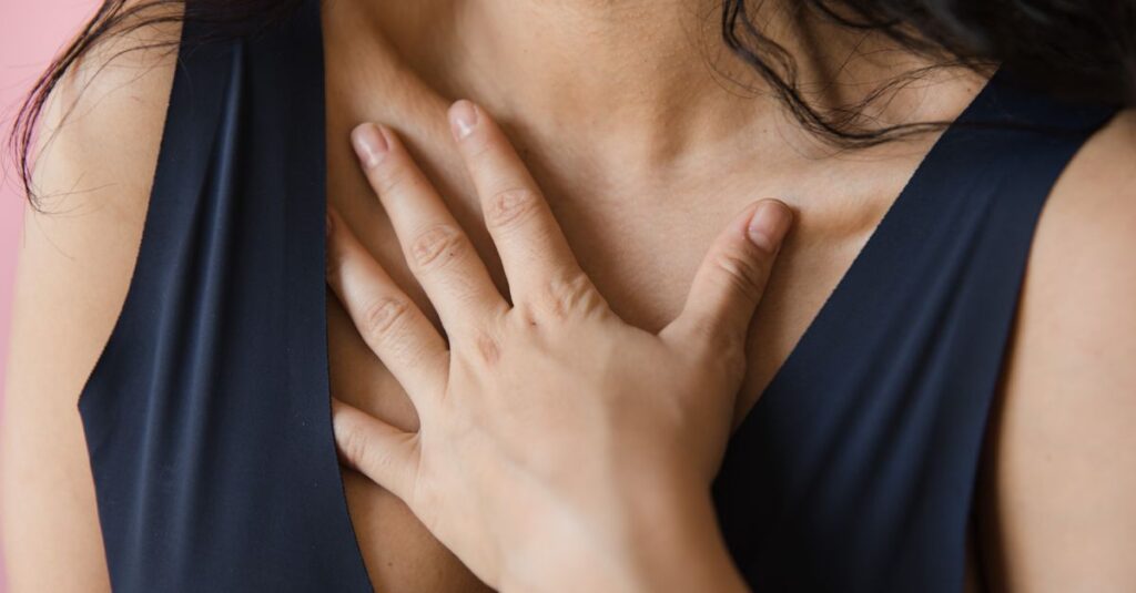 gentle hands near heart quiet self awareness soft room