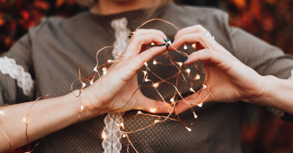 gentle hands near heart soft light self respect calm