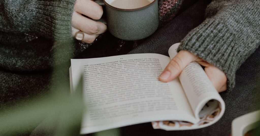 soft hands holding warm cup quiet room gentle light