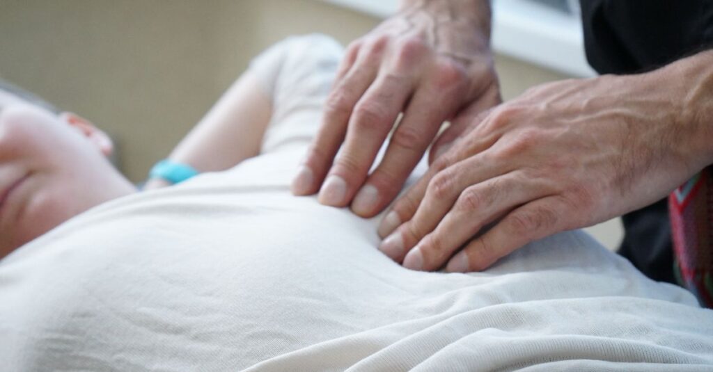 soft hands gentle touch quiet healing light calm body awareness warm atmosphere