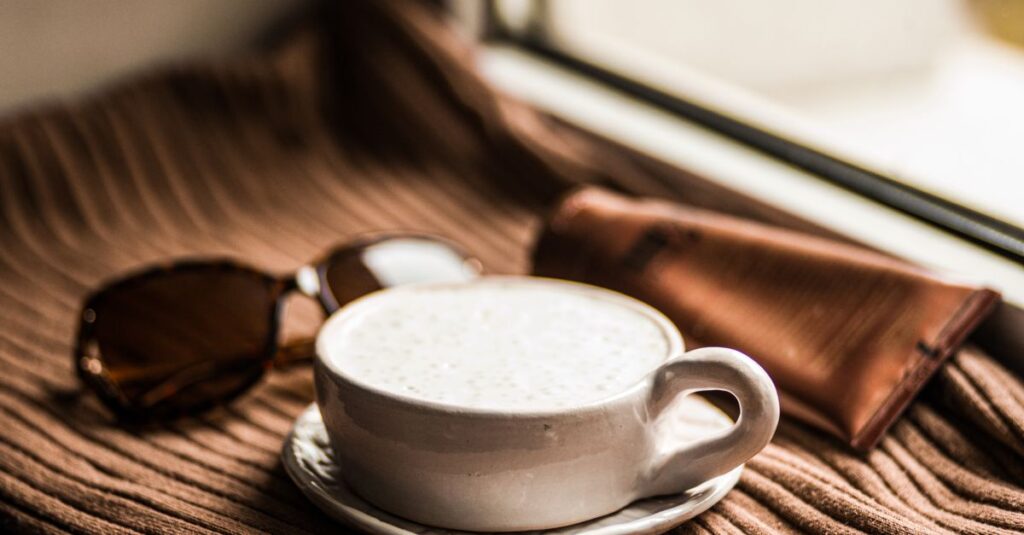 soft window light warm drink quiet pause gentle atmosphere