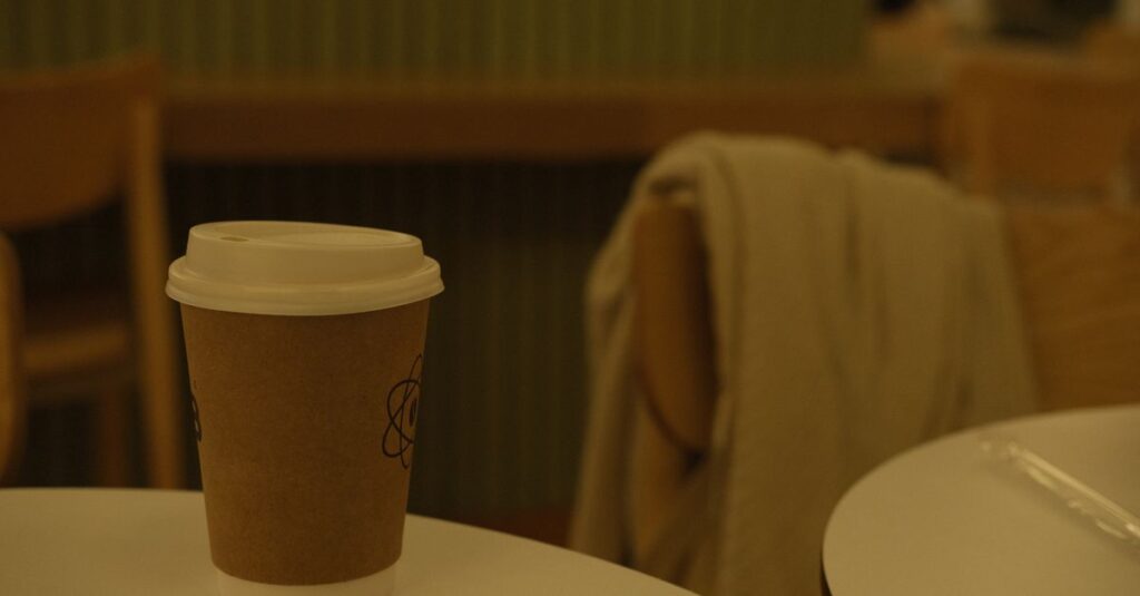 empty cup quiet table soft light exhausted depleted calm gentle atmosphere