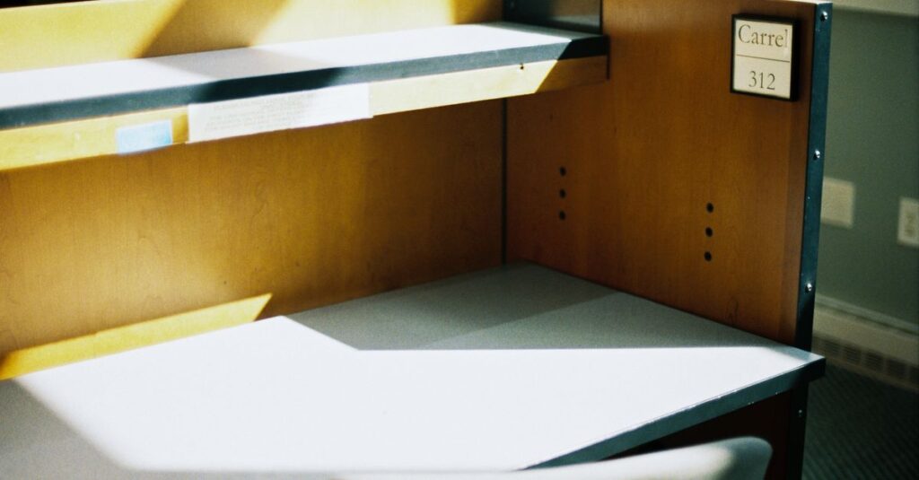 empty desk soft light letting go quiet simplicity gentle calm space