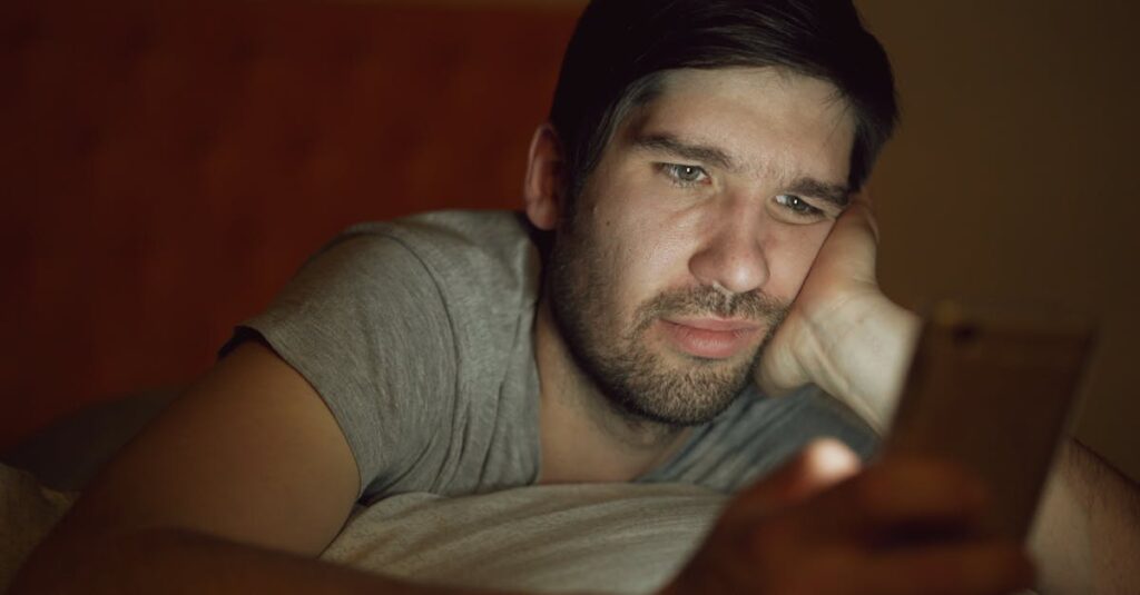 scrolling phone comparison feeling quiet night self doubt soft light