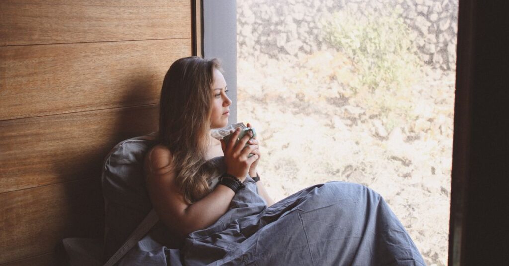 soft window light warm drink quiet pause gentle atmosphere