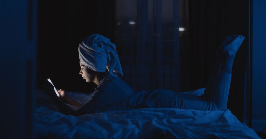 scrolling phone comparison feeling quiet night self doubt soft light